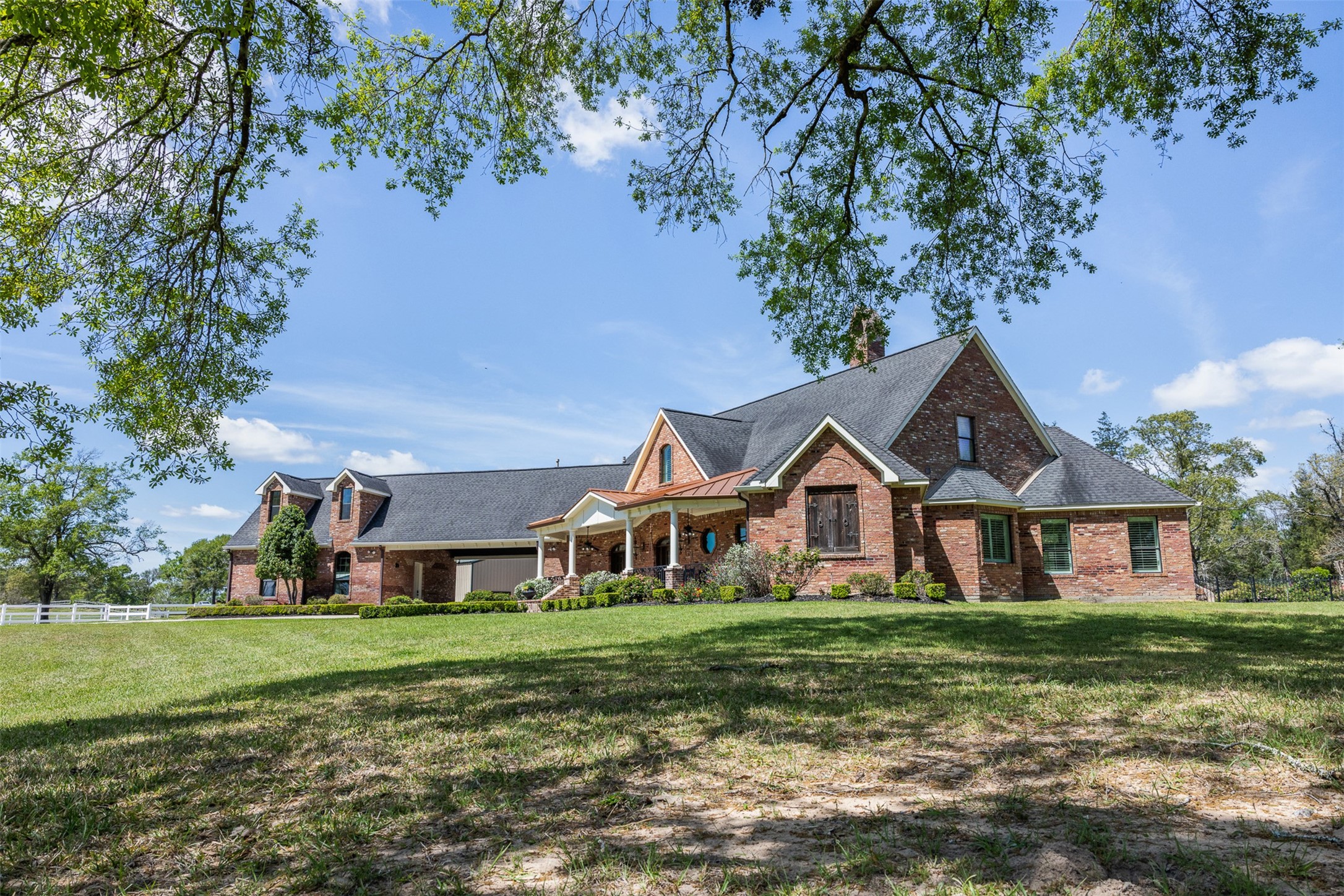 29500 Skymac Ranch Road Hempstead, TX 77445 - Photo 3 of 50 Timeless brick architecture complemented by expansive grounds and a welcoming front porch.