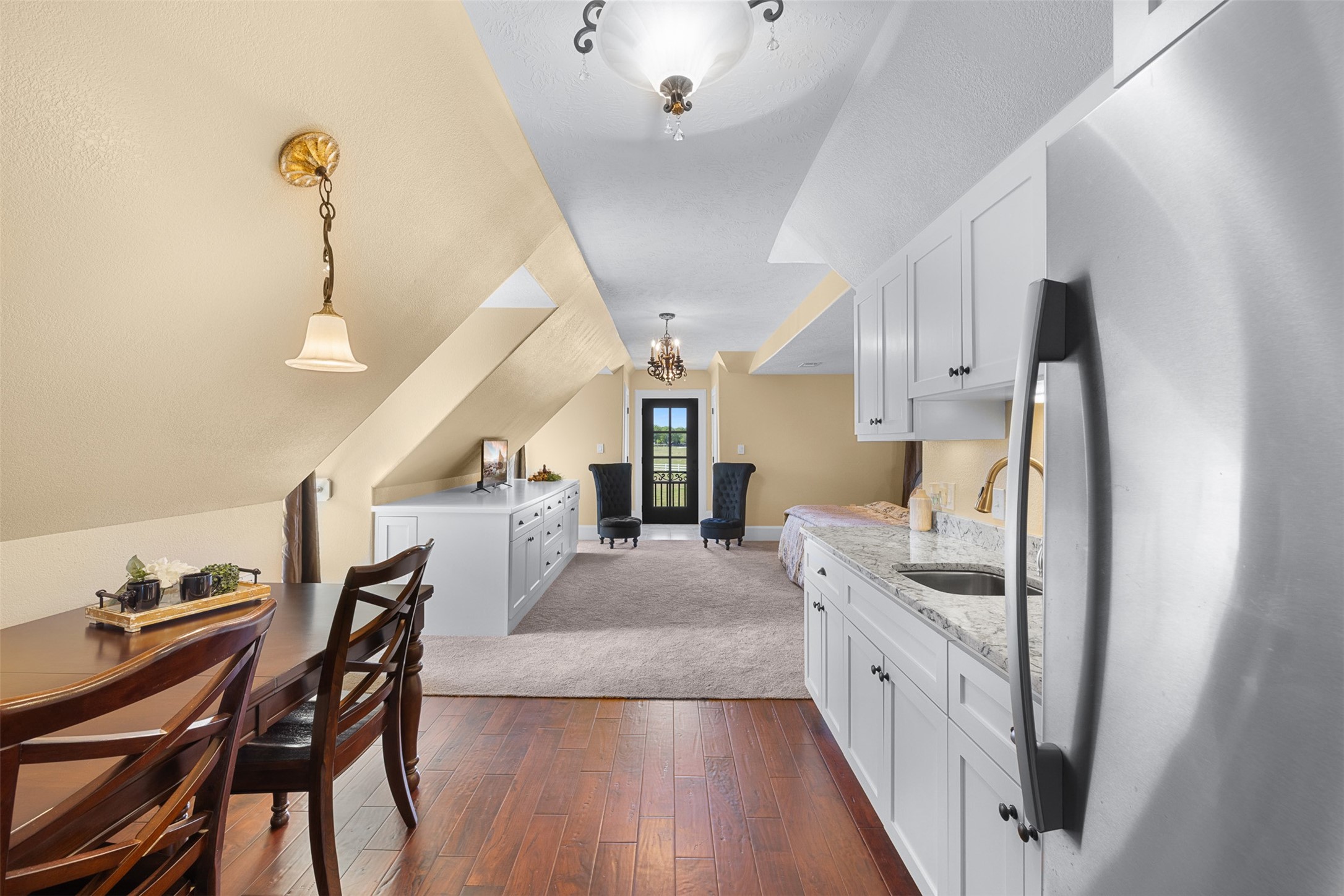 29500 Skymac Ranch Road Hempstead, TX 77445 - Photo 37 of 50 This apartment-style space is thoughtfully designed with a kitchenette featuring a refrigerator, sink, and cabinetry, complemented by a dedicated dining area. Built-in storage and a defined sleeping space create a comfortable, self-contained retreat ideal for guests or extended stays