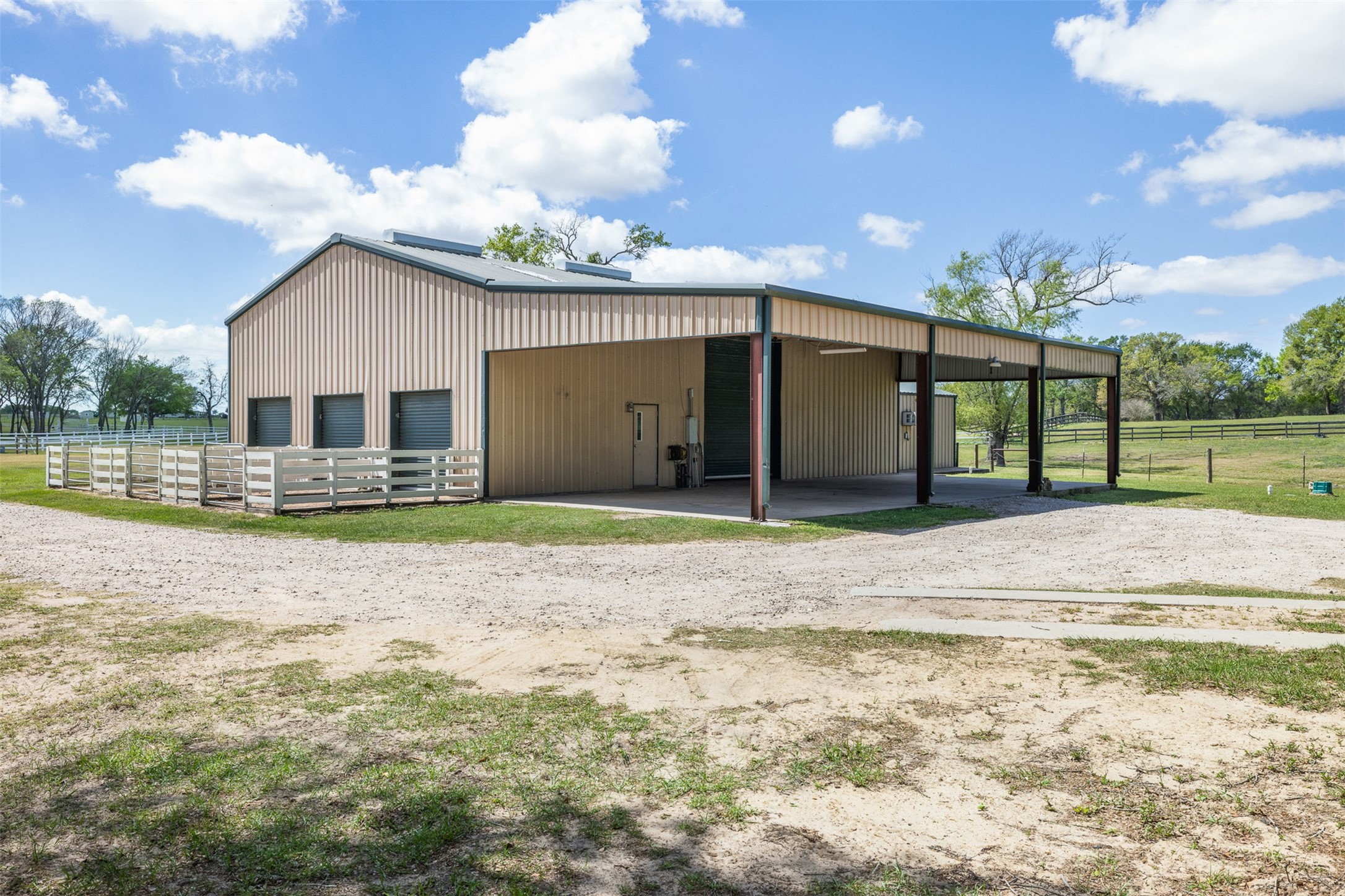 29500 Skymac Ranch Road Hempstead, TX 77445 - Photo 45 of 50 A large insulated metal shop adds exceptional versatility to the property, complete with integrated horse stalls—ideal for equestrian use, storage, or workshop space.