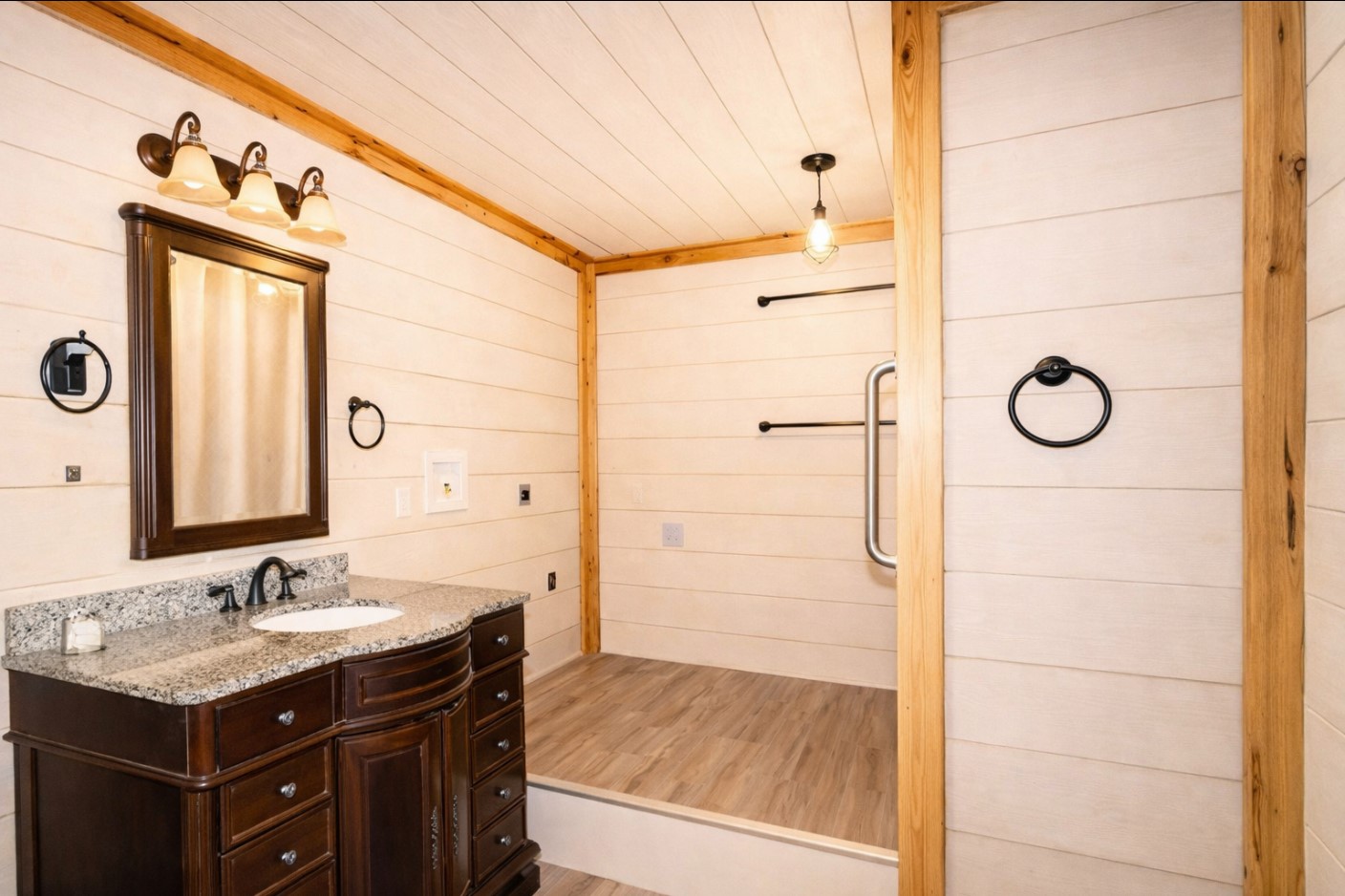 29500 Skymac Ranch Road Hempstead, TX 77445 - Photo 47 of 50 A full bath within the shop features a furniture-style vanity and an elevated whirlpool tub, offering both character and functionality—well-suited for everyday use or bathing animals.