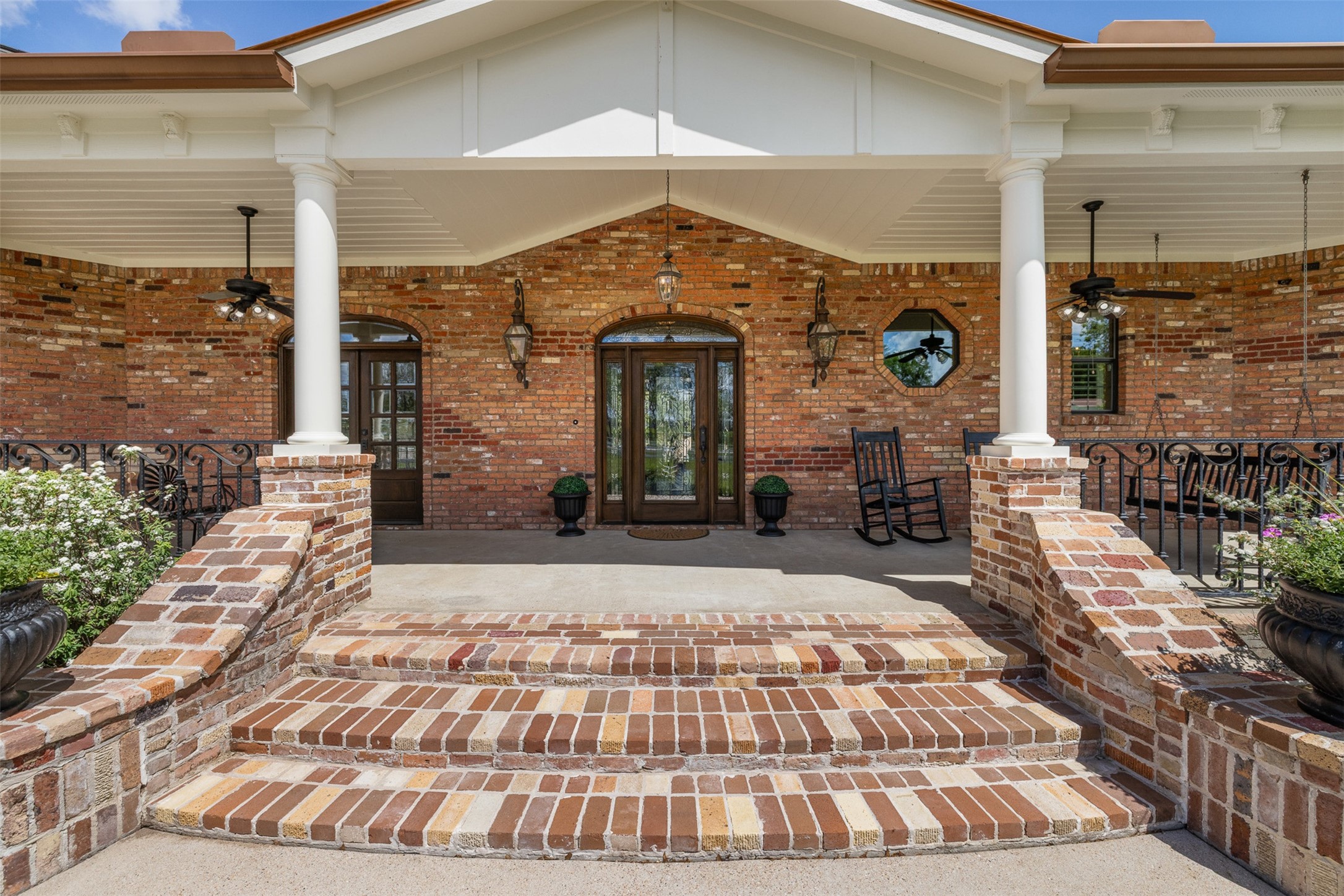 29500 Skymac Ranch Road Hempstead, TX 77445 - Photo 8 of 50 A grand front entry framed by classic columns and timeless brick detailing creates a refined welcome.
