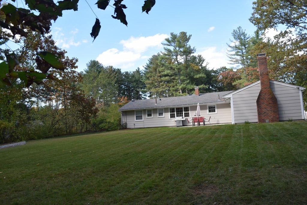 18 Muriel Road Chelmsford, MA 01824 - Photo 16 of 22 a front view of a house with a yard
