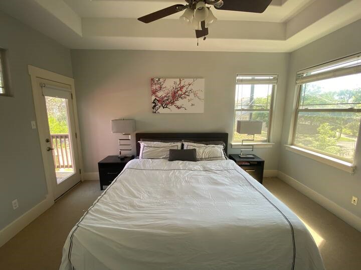 1007 Taulbee Lane, Unit A Austin, TX 78757 - Photo 11 of 17 a bedroom with a large bed and a window
