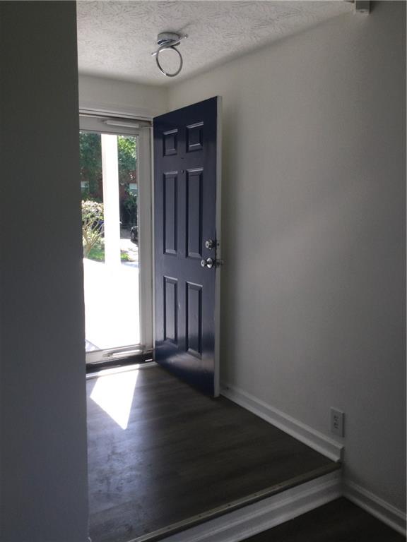 3186 Kingswood Glen Decatur, GA 30034 - Photo 22 of 23 an empty room with wooden floor and a window
