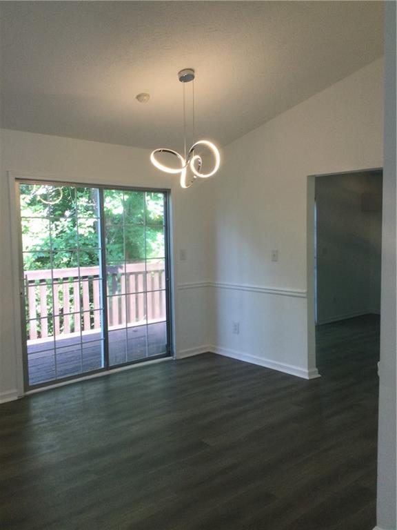 3186 Kingswood Glen Decatur, GA 30034 - Photo 6 of 23 an empty room with wooden floor and windows
