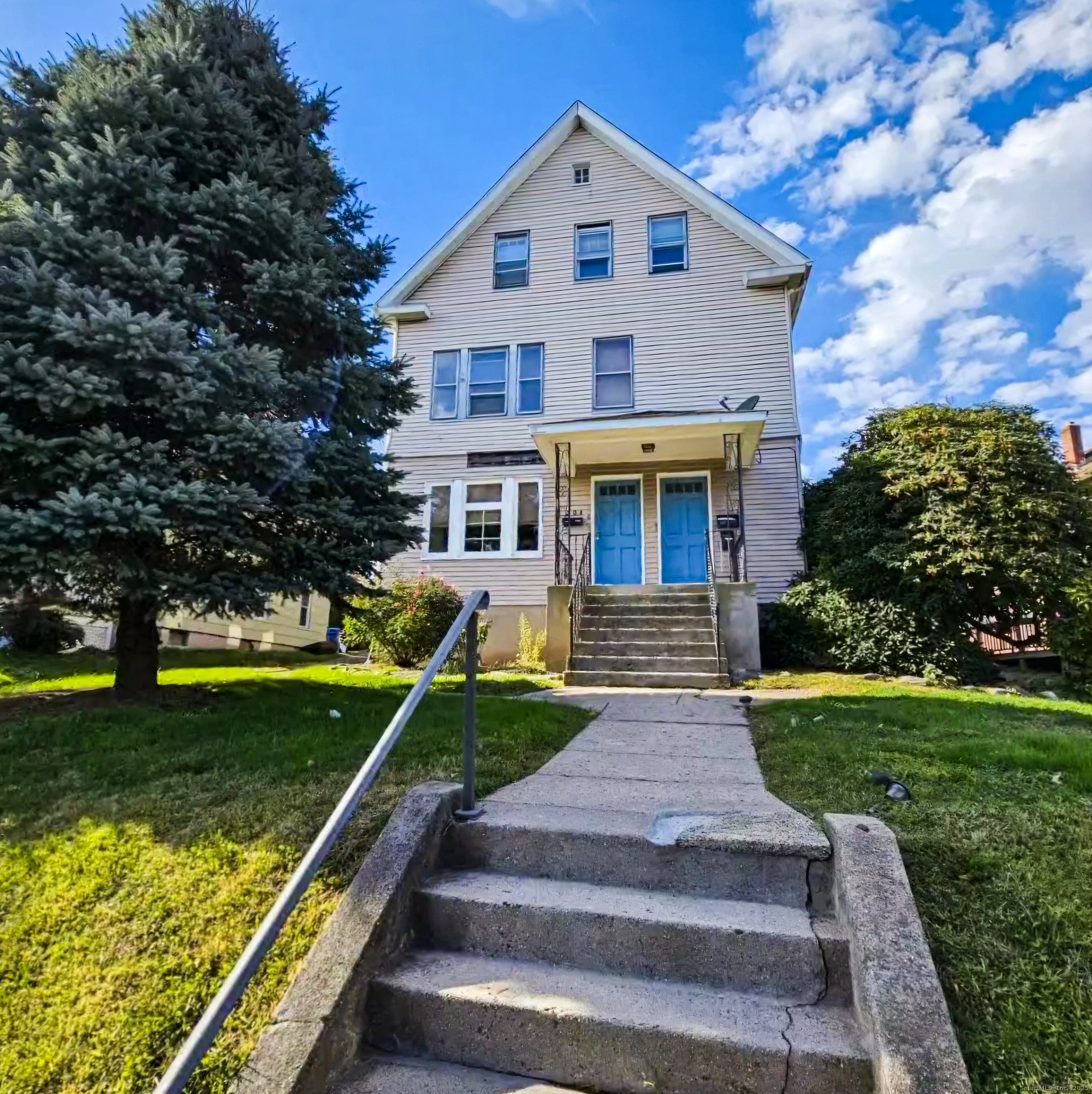 a front view of a house with a yard