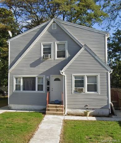 40 Mason Street Hempstead, NY 11550 - Photo 1 of 1 a front view of a house with a yard
