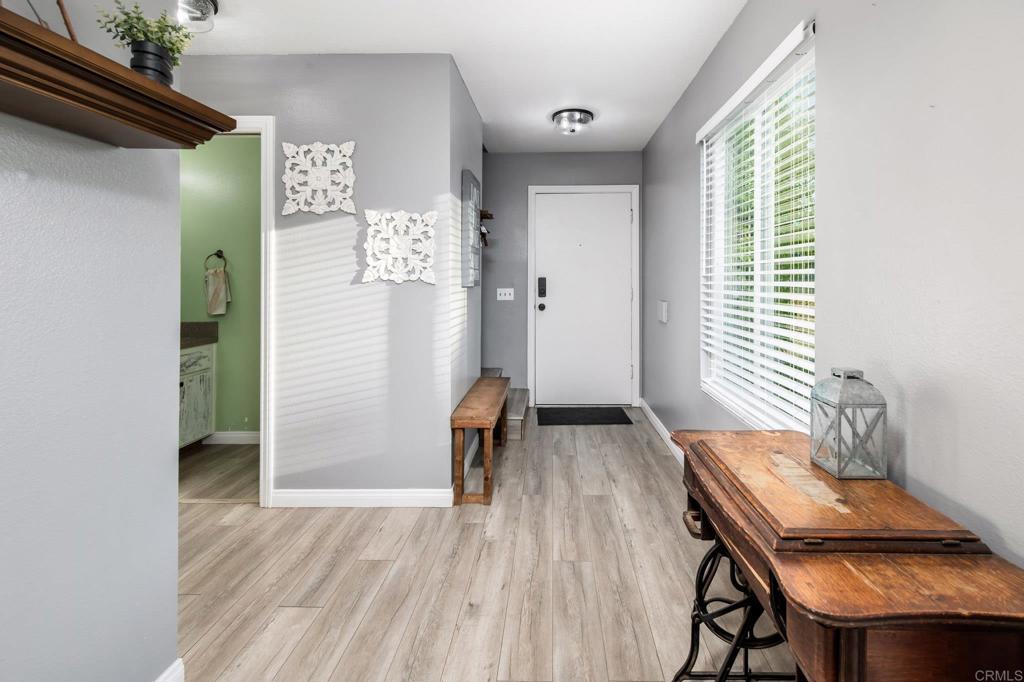 435 West Hawthorne Street Fallbrook, CA 92028 - Photo 18 of 42 a room with wooden floor and a window
