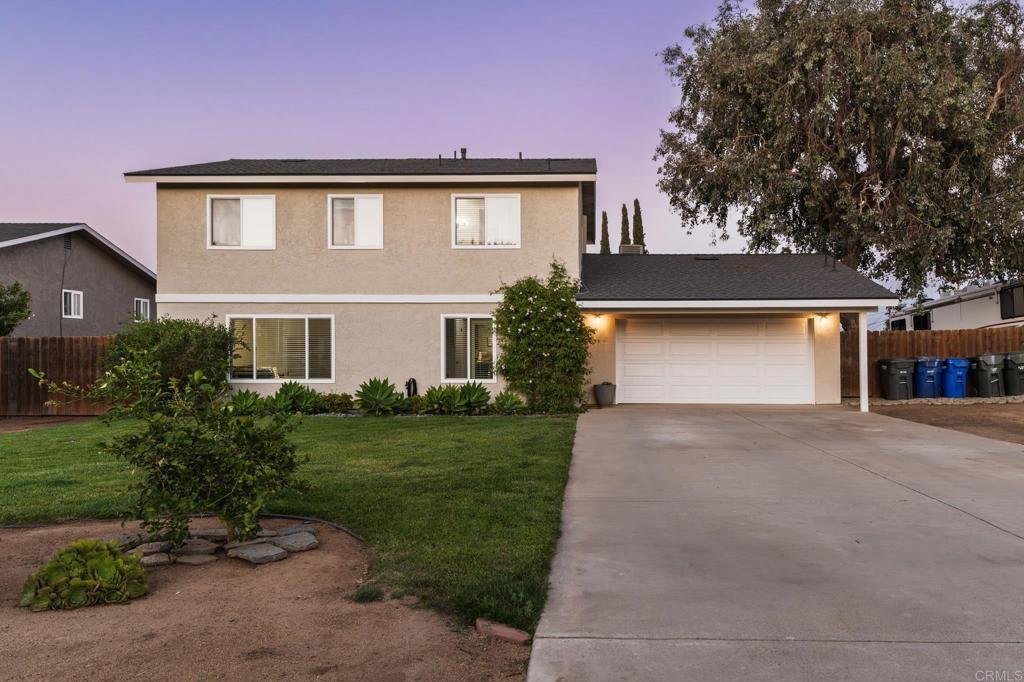 435 West Hawthorne Street Fallbrook, CA 92028 - Photo 2 of 42 front view of a house with a yard