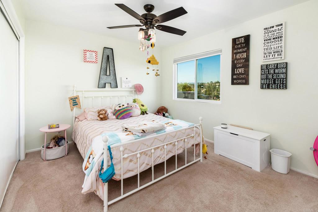 435 West Hawthorne Street Fallbrook, CA 92028 - Photo 21 of 42 a bedroom with a bed and a window