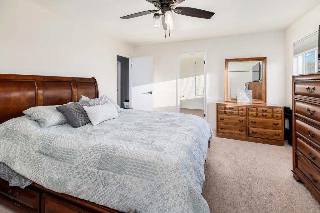 435 West Hawthorne Street Fallbrook, CA 92028 - Photo 24 of 42 a bedroom with a bed and dresser