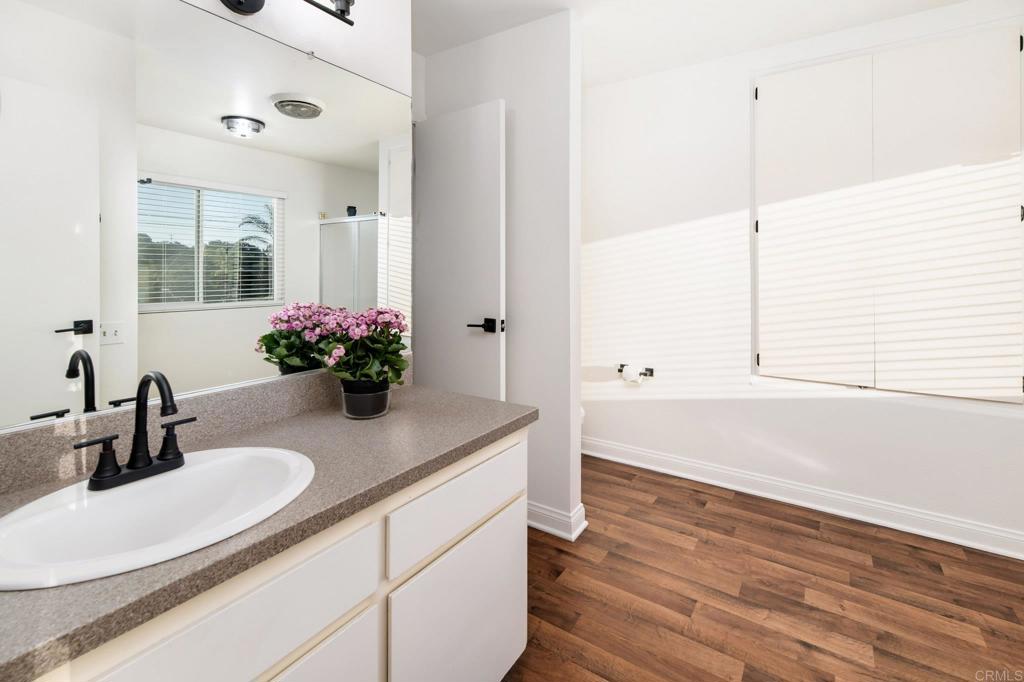 435 West Hawthorne Street Fallbrook, CA 92028 - Photo 26 of 42 a kitchen with a sink and a large mirror