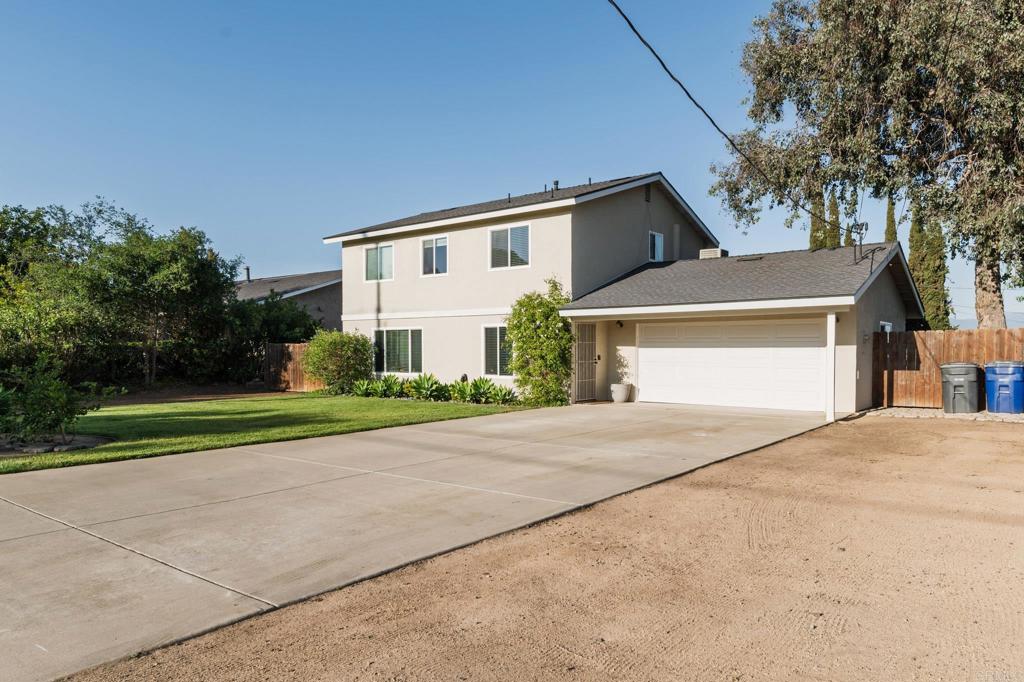 435 West Hawthorne Street Fallbrook, CA 92028 - Photo 3 of 42 a front view of house with yard and green space