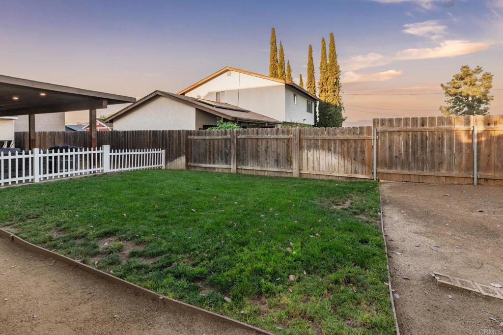 435 West Hawthorne Street Fallbrook, CA 92028 - Photo 36 of 42 a view of a house with a yard and deck