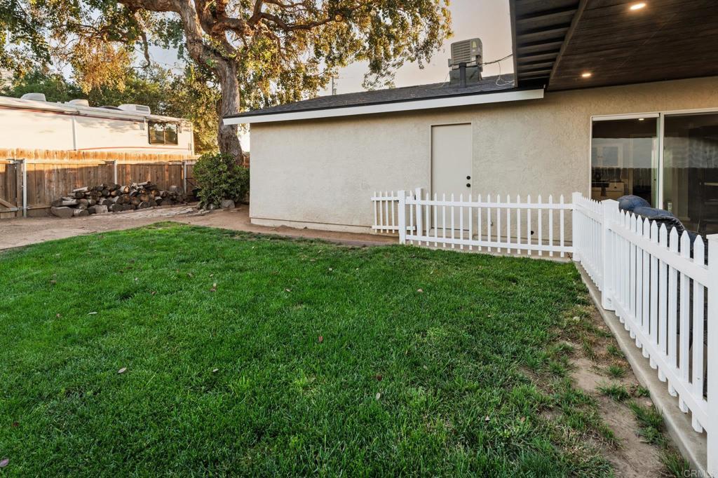 435 West Hawthorne Street Fallbrook, CA 92028 - Photo 38 of 42 a view of a porch with a yard