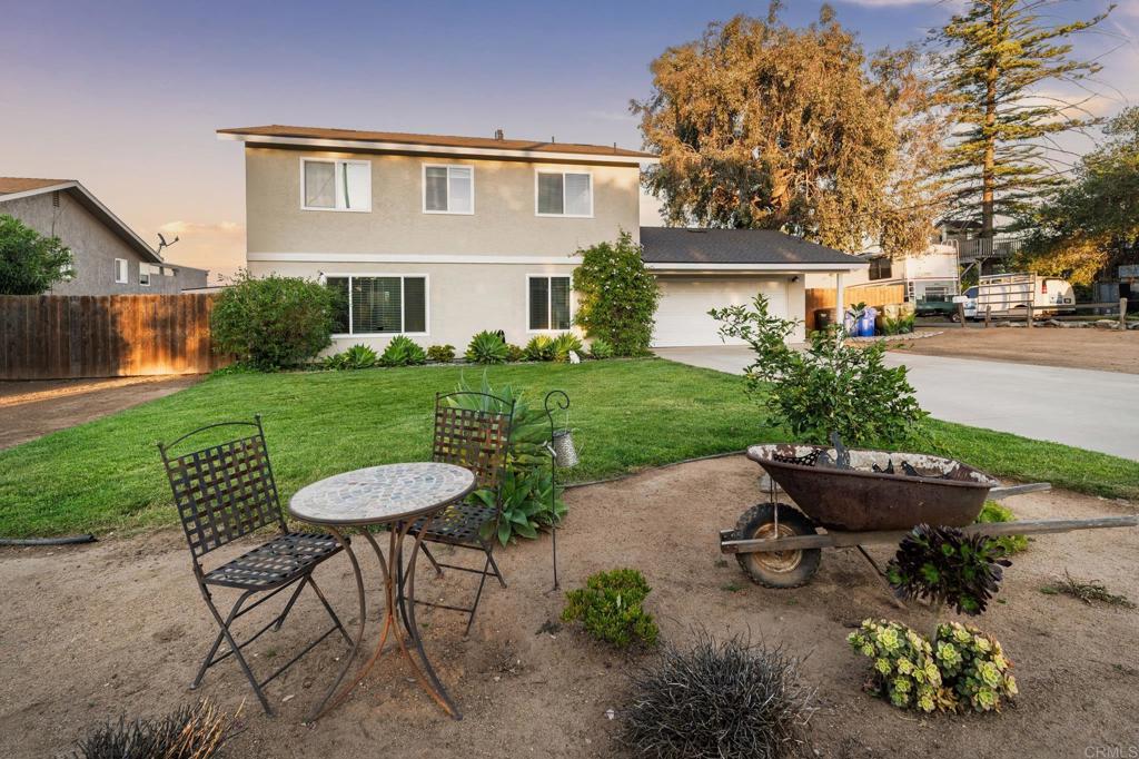 435 West Hawthorne Street Fallbrook, CA 92028 - Photo 41 of 42 a view of a house with backyard sitting area and garden