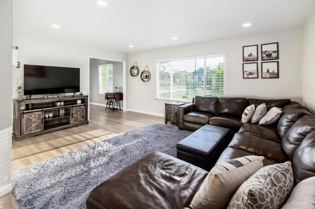 435 West Hawthorne Street Fallbrook, CA 92028 - Photo 9 of 42 a living room with furniture and a flat screen tv