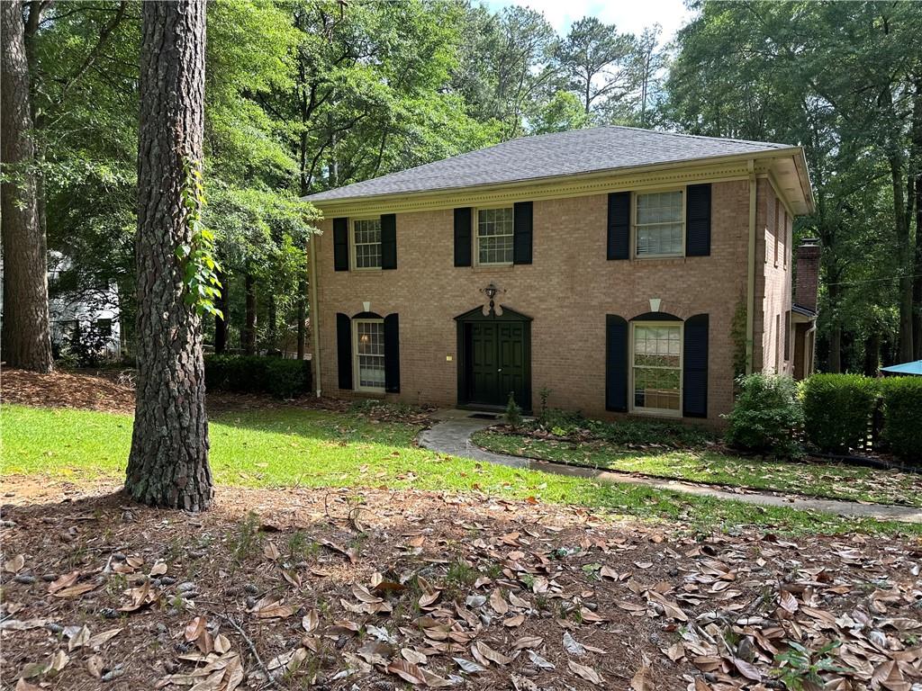 a view of a house with a yard