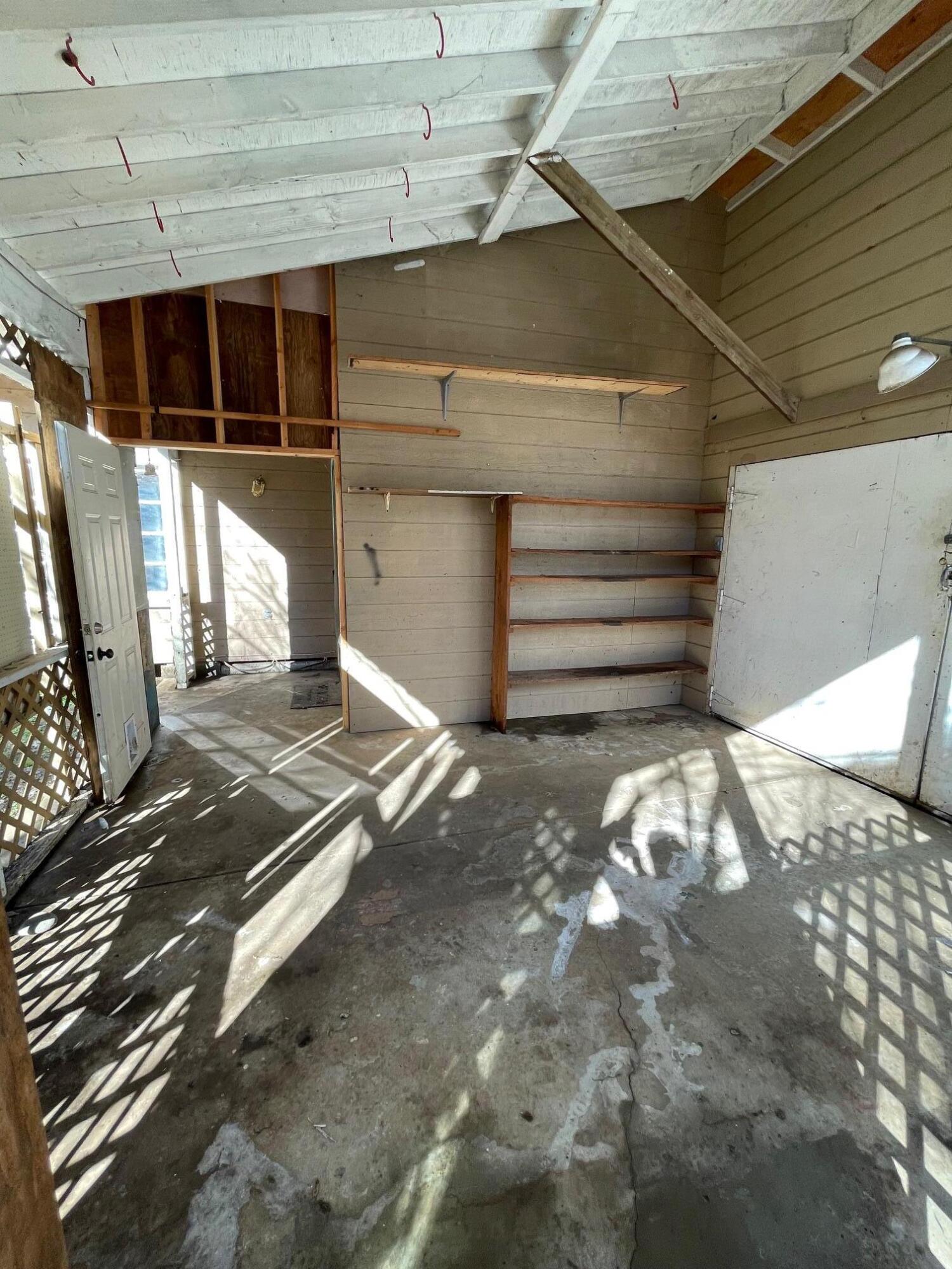 411 South Old Stage Road Cave Junction, OR 97523 - Photo 20 of 39 a view of a room with wooden walls