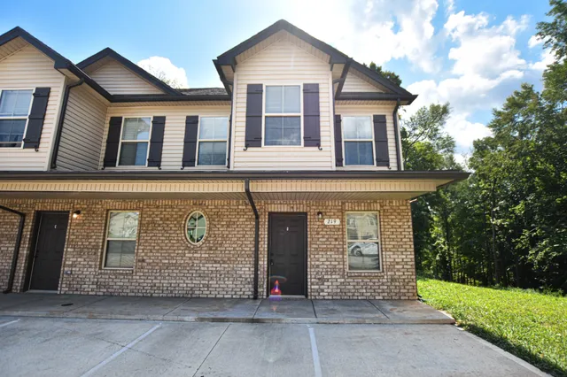 a front view of a house with garage