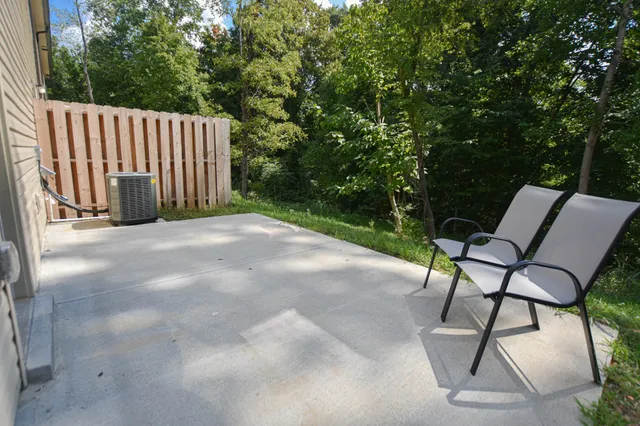 a view of backyard with a table and chairs