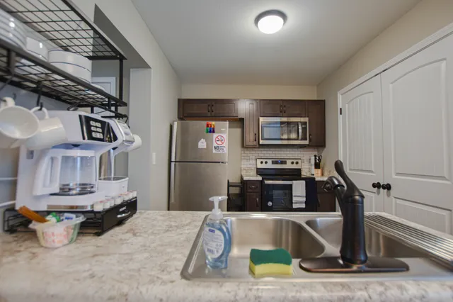 a kitchen with a stove and a refrigerator