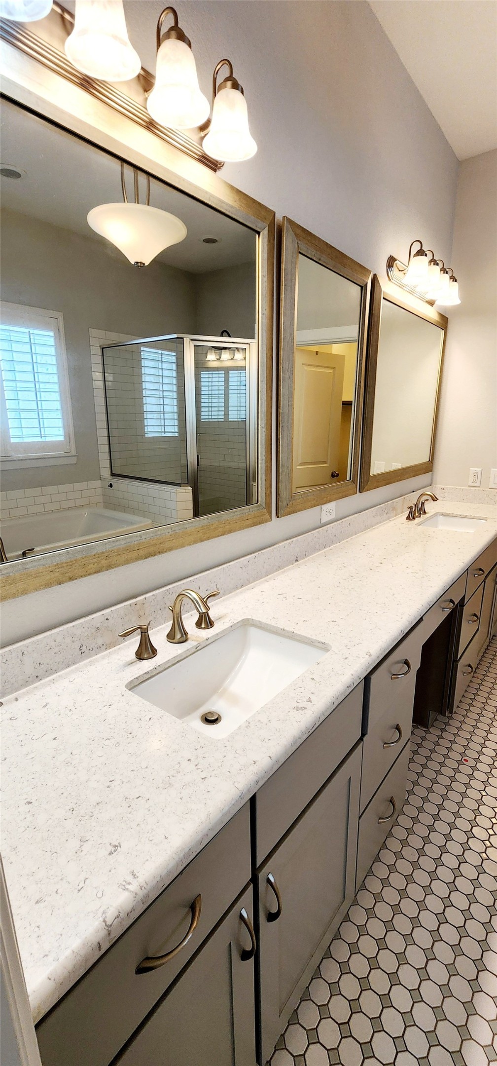 11 West Rafters Row The Woodlands, TX 77380 - Photo 27 of 31 a bathroom with a sink and a mirror