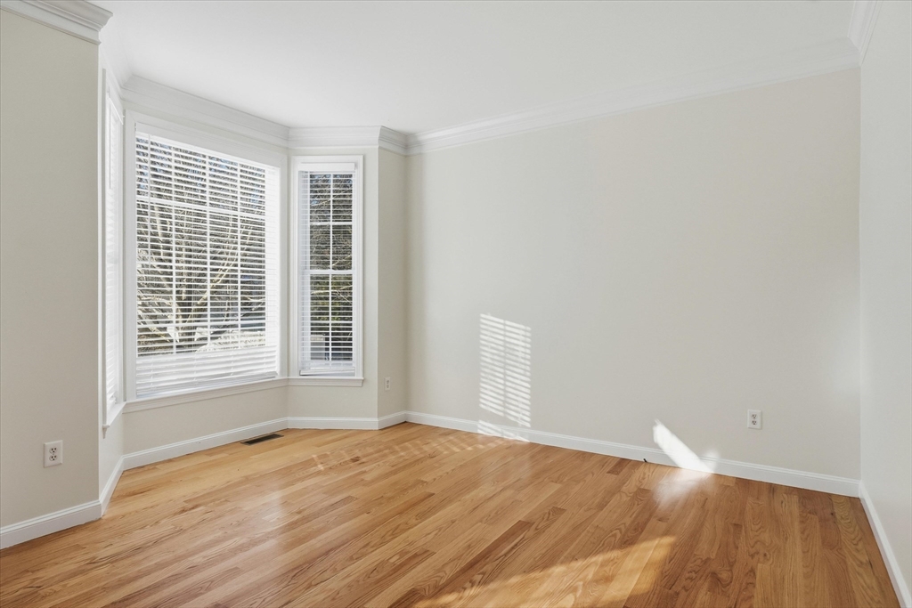 14 Amberville Road North Andover, MA 01845 - Photo 5 of 42 a view of empty room with wooden floor and fan