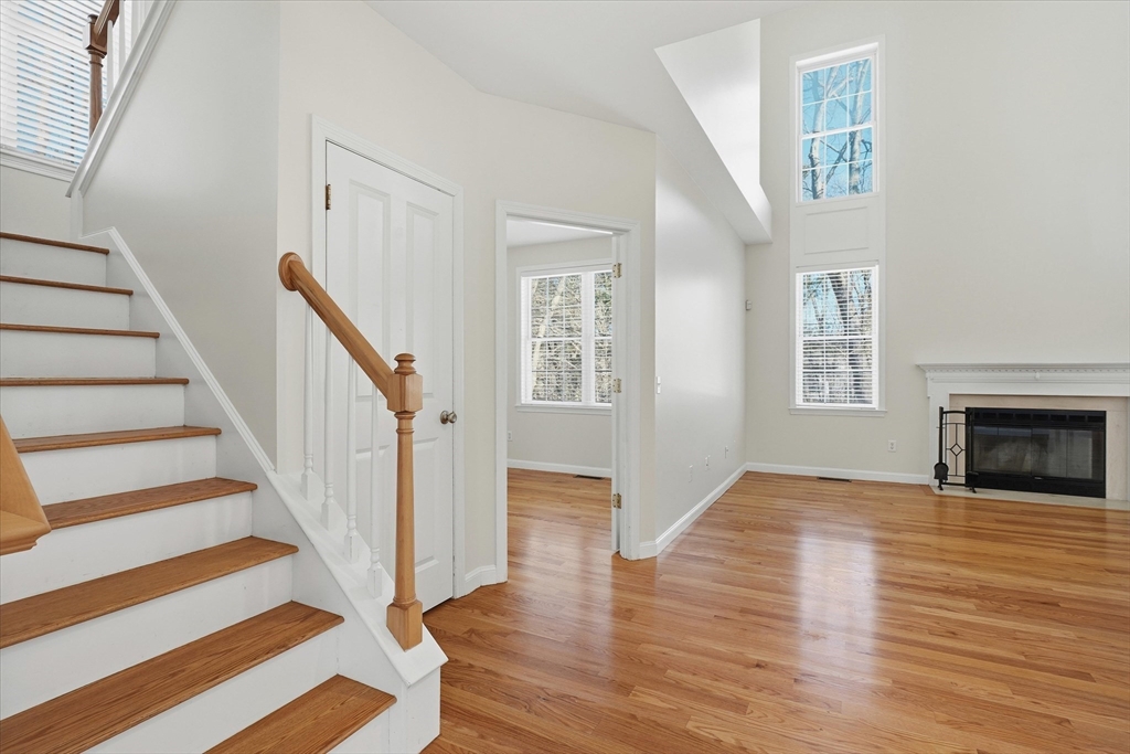 14 Amberville Road North Andover, MA 01845 - Photo 8 of 42 a view of an empty room with wooden floor and a fireplace