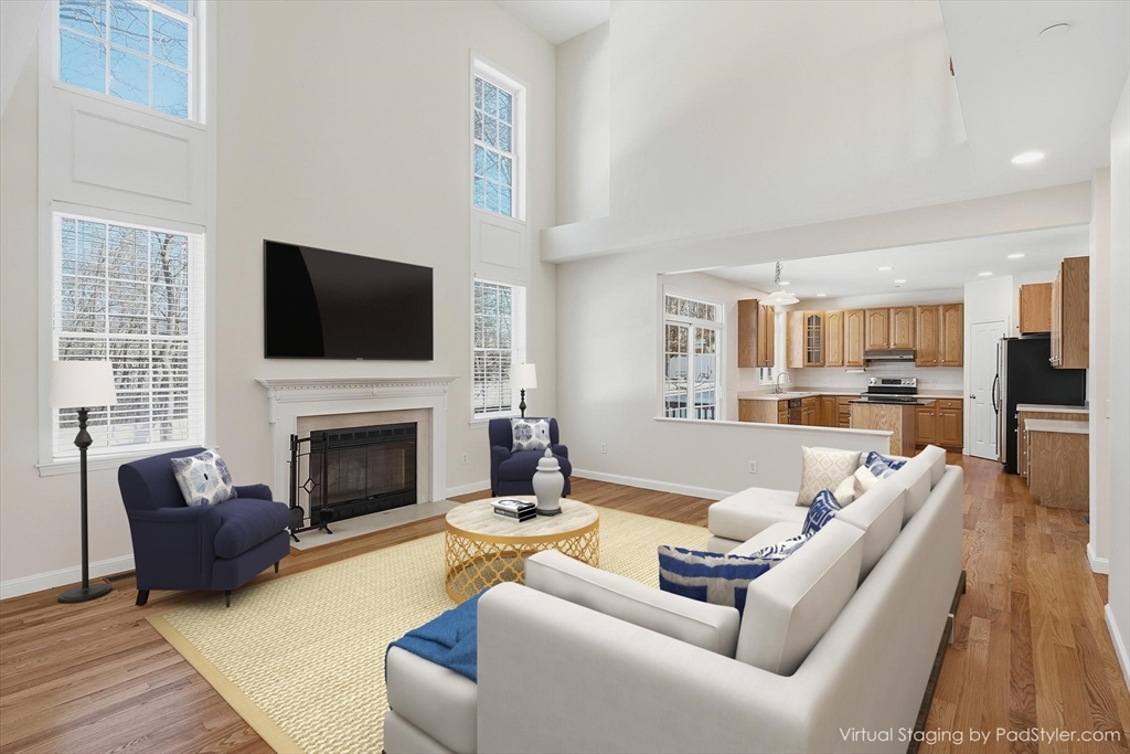 14 Amberville Road North Andover, MA 01845 - Photo 9 of 42 a living room with furniture fireplace and a flat screen tv