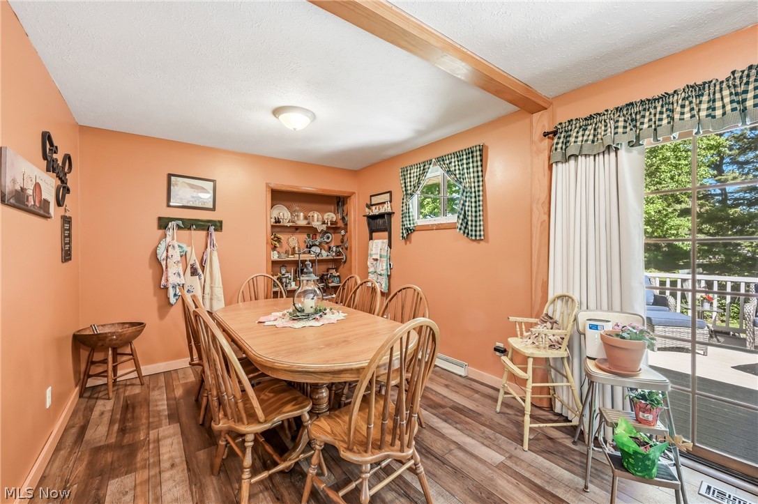 6127 Columbus Road Northeast Louisville, OH 44641 - Photo 13 of 49 Dining room with built-in shelving