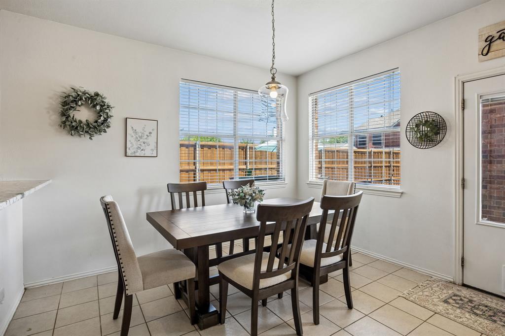 5315 Summit Knoll Trail Sachse, TX 75048 - Photo 11 of 40 a view of a dining room with furniture window and outside view