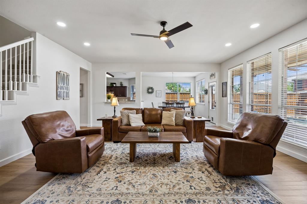 5315 Summit Knoll Trail Sachse, TX 75048 - Photo 12 of 40 a living room with furniture and a wooden floor