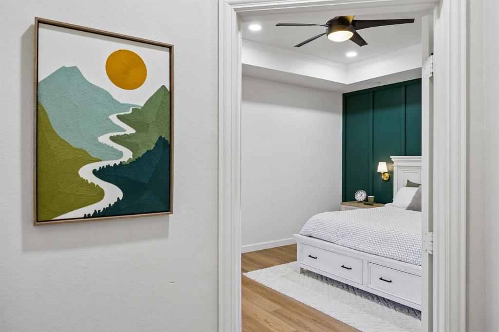 5315 Summit Knoll Trail Sachse, TX 75048 - Photo 16 of 40 a bedroom with a bed and painting on the wall