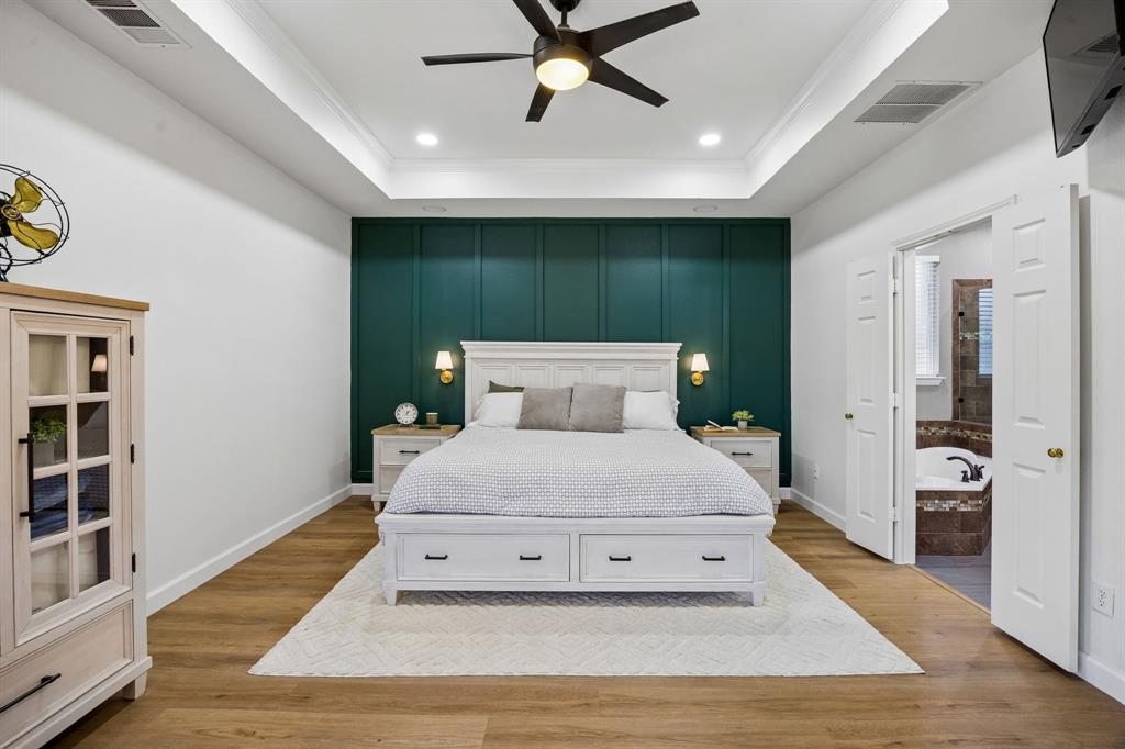 5315 Summit Knoll Trail Sachse, TX 75048 - Photo 17 of 40 a bedroom with a bed and window