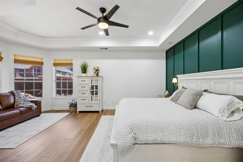 5315 Summit Knoll Trail Sachse, TX 75048 - Photo 19 of 40 a bedroom with a large bed closet and a window