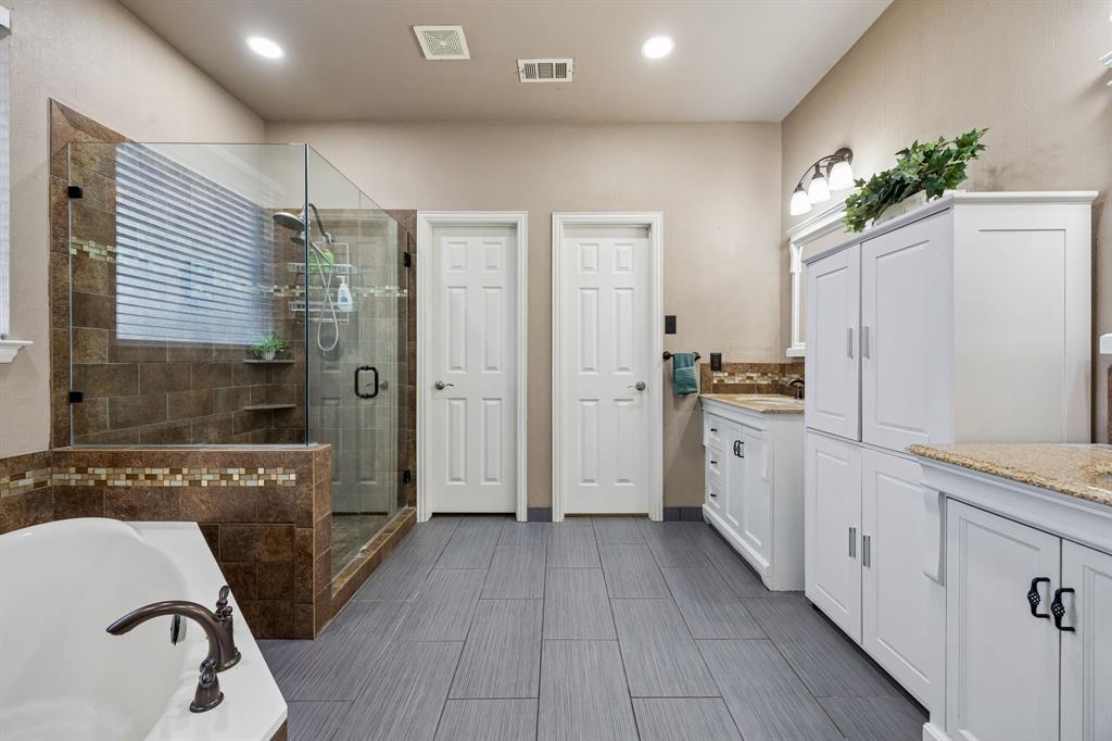 5315 Summit Knoll Trail Sachse, TX 75048 - Photo 21 of 40 a view of a kitchen with a sink and refrigerator