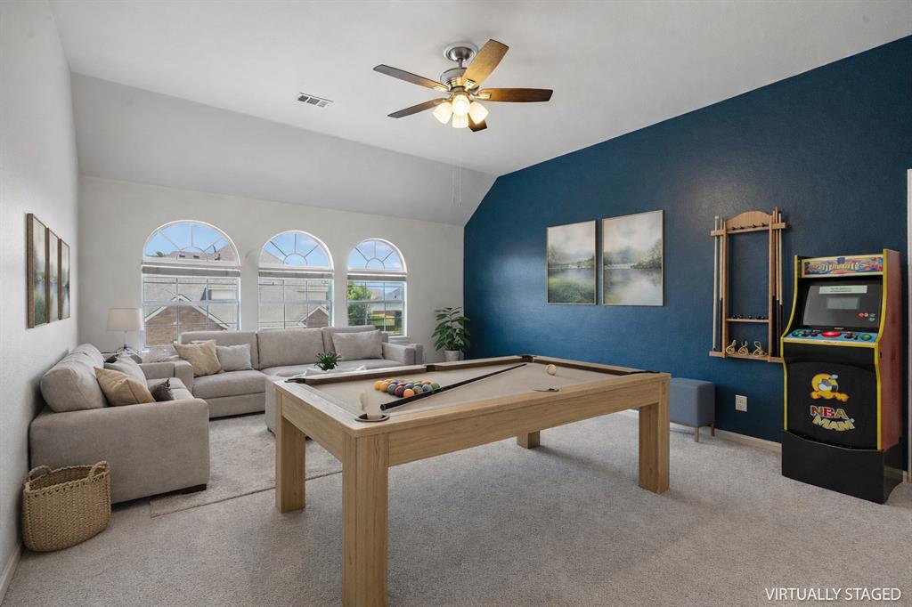 5315 Summit Knoll Trail Sachse, TX 75048 - Photo 26 of 40 a living room with furniture and a flat screen tv