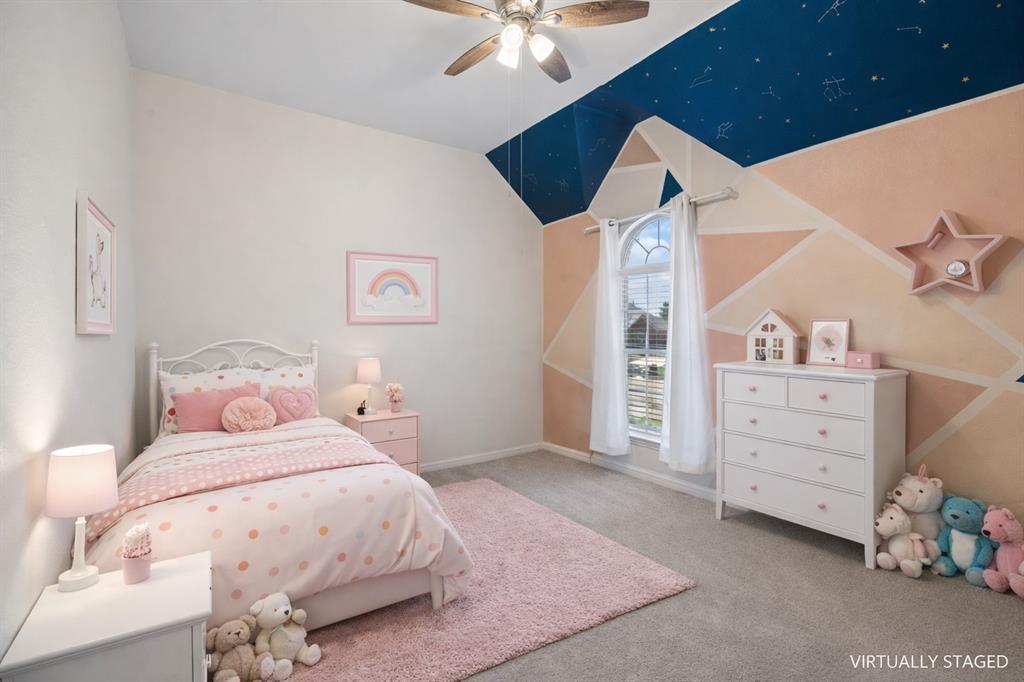 5315 Summit Knoll Trail Sachse, TX 75048 - Photo 28 of 40 a bedroom with a bed and a cabinets