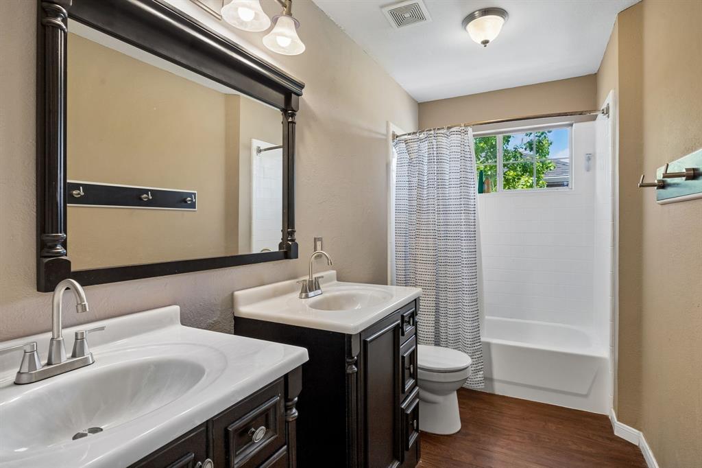 5315 Summit Knoll Trail Sachse, TX 75048 - Photo 30 of 40 a bathroom with a sink a toilet and shower