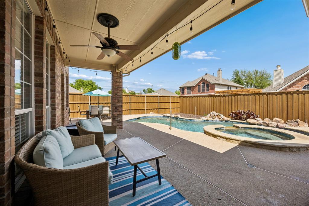5315 Summit Knoll Trail Sachse, TX 75048 - Photo 35 of 40 a roof deck with couches and wooden floor