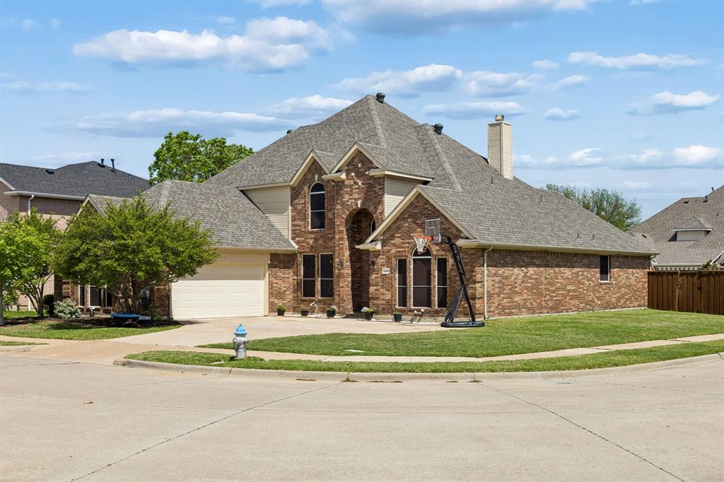 5315 Summit Knoll Trail Sachse, TX 75048 - Photo 37 of 40 a front view of a house with a yard and garage