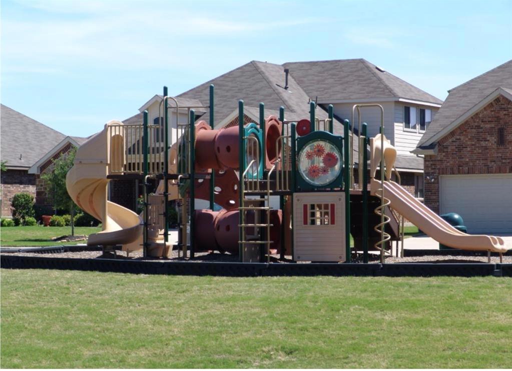 5315 Summit Knoll Trail Sachse, TX 75048 - Photo 38 of 40 a front view of a house with swimming pool and a yard