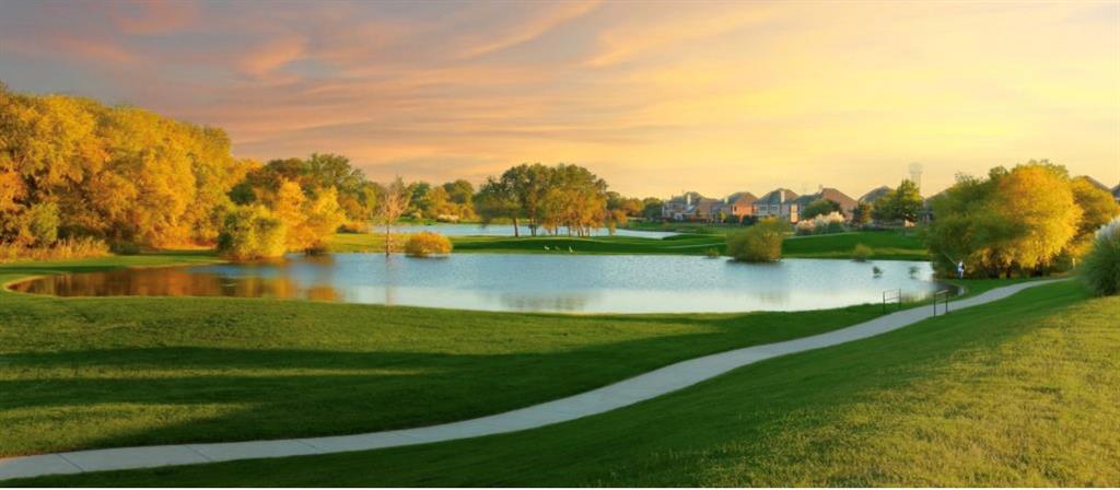 5315 Summit Knoll Trail Sachse, TX 75048 - Photo 40 of 40 a view of a lake with houses in the back