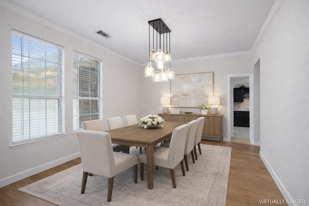 5315 Summit Knoll Trail Sachse, TX 75048 - Photo 7 of 40 a view of a dining room with furniture window and outside view