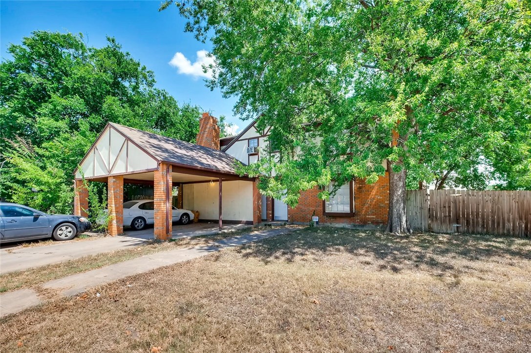 1306 East St Johns Avenue Austin, TX 78752 - Photo 1 of 1 a view of a car park in front of house