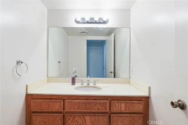 a en suite bathroom with a sink and a mirror