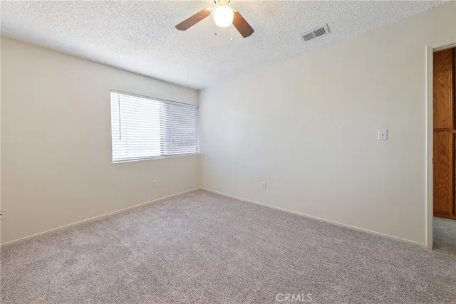 an empty room with a bathroom