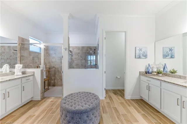 a spacious bathroom with a granite countertop sink a toilet and shower