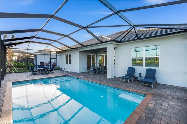 a view of a swimming pool with a patio